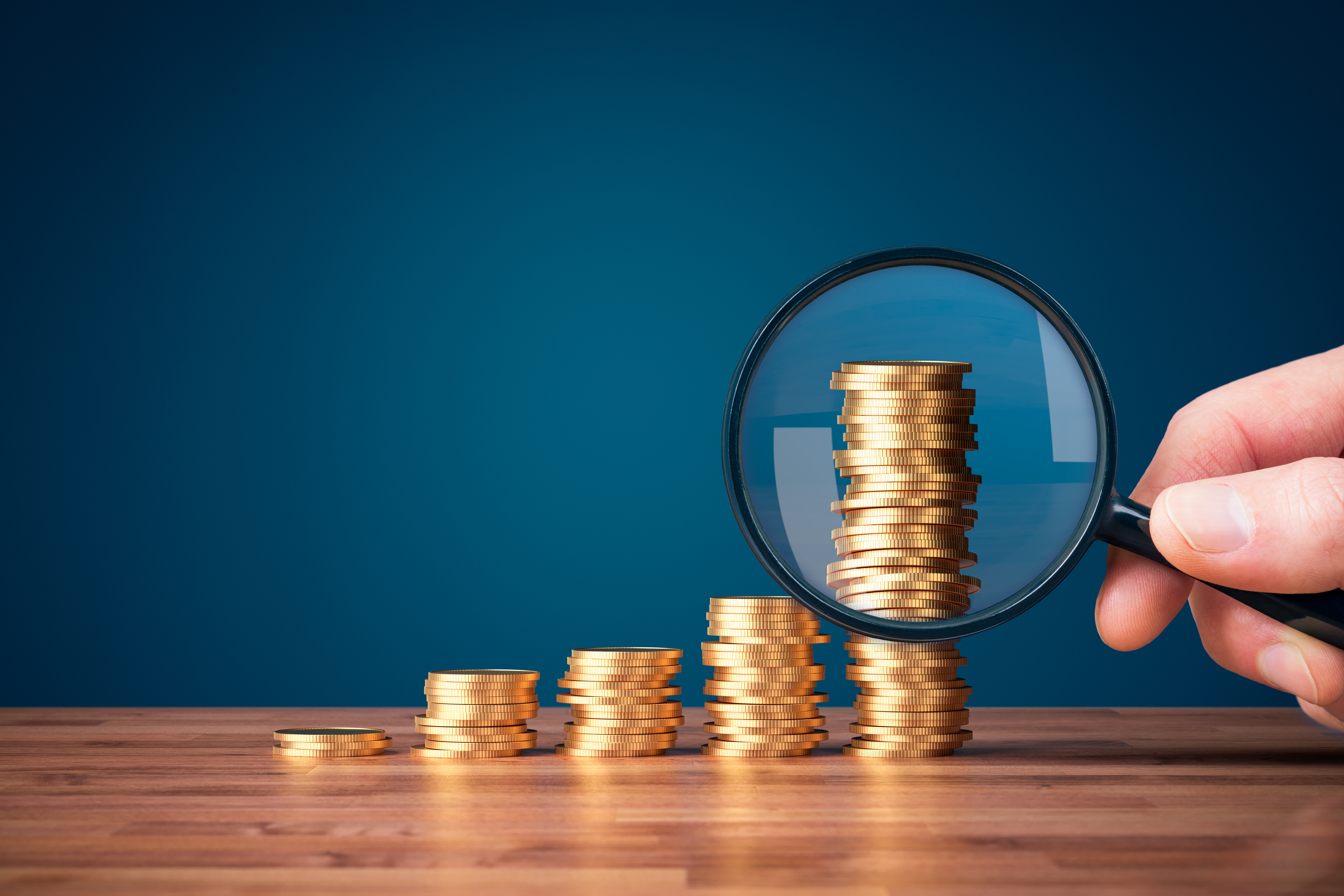 adobestock_435436717_magnifying-glass-and-money.jpeg