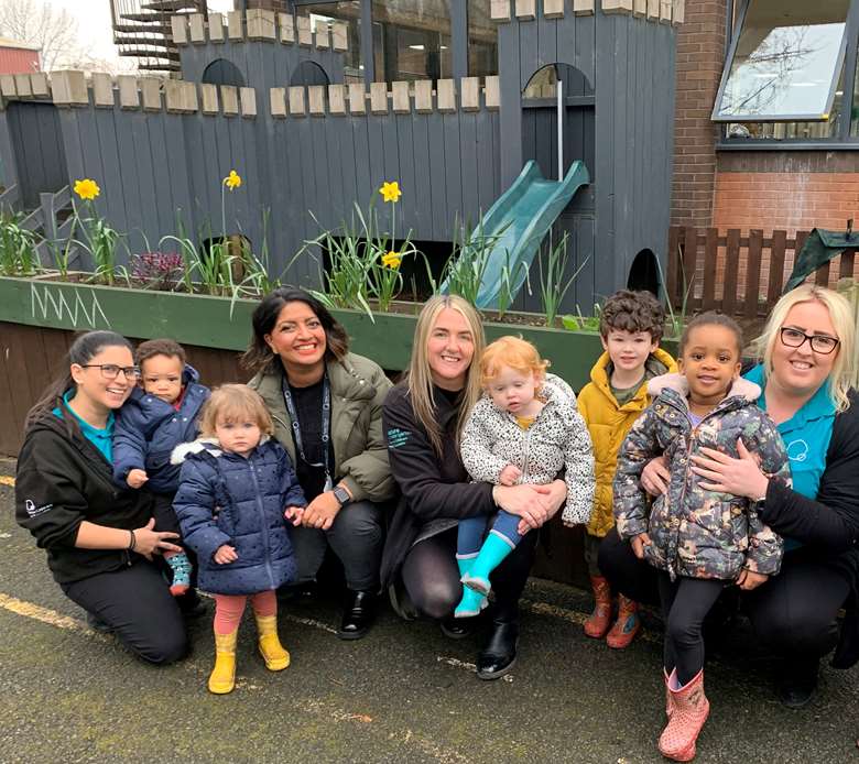 Azma Broughton (back row, third from left) with colleagues and children at Thrive’s Media City Nature Kindergarten in Salford