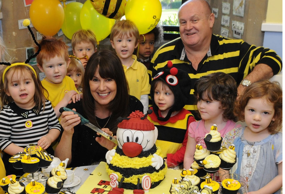 burntwood-busy-bees-children-enjoying-birthday-cakes-with-founders-marg-randles-md-and-john-woodward-ceo-cropped.jpg