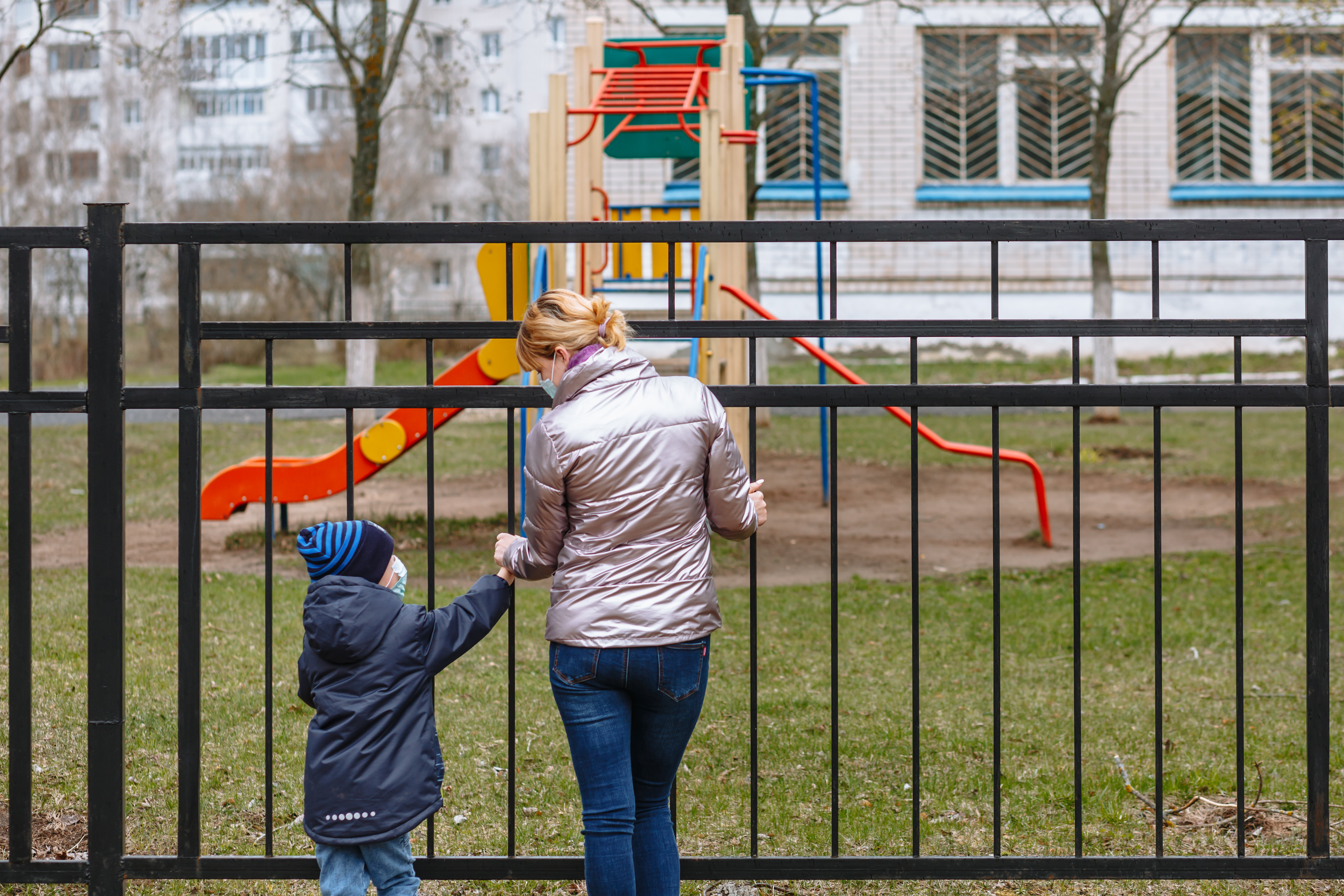 mum-with-boy-wearing-masks-by-playground.jpeg