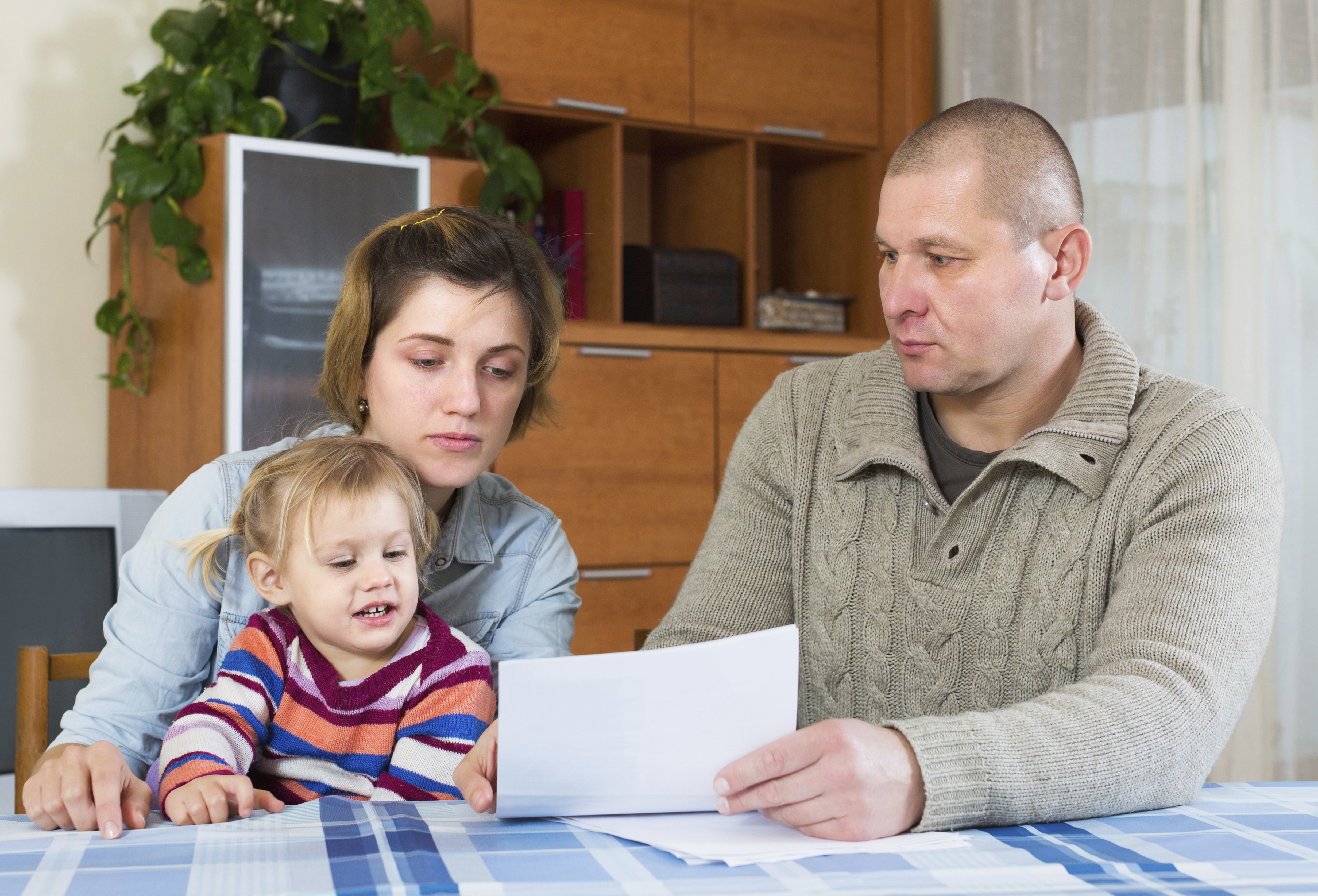 family-looking-at-bill.jpg