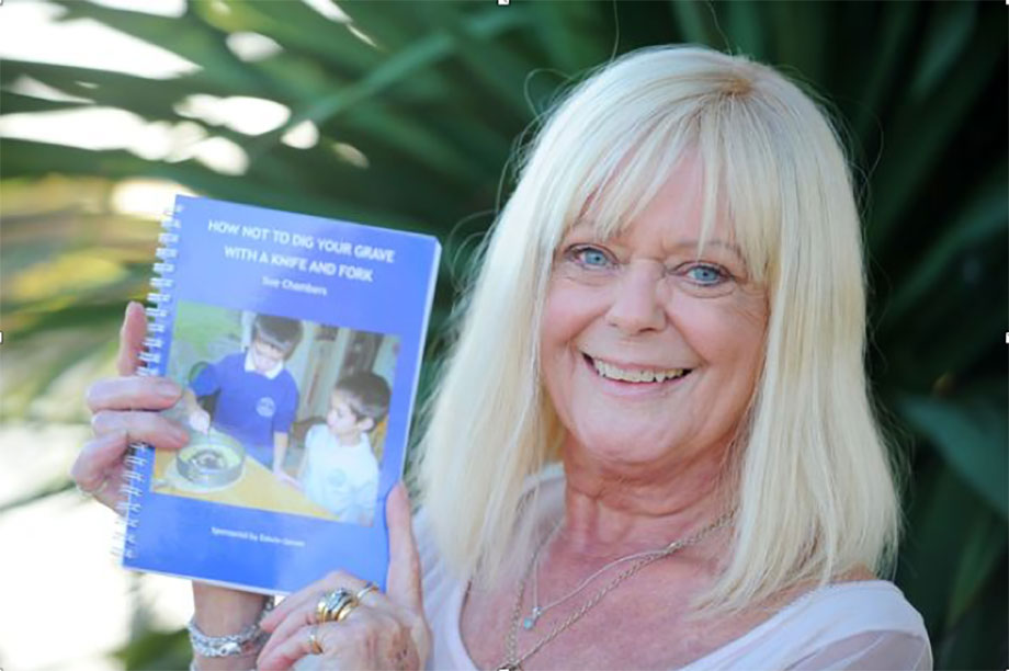 sue-chambers-with-her-book.jpg