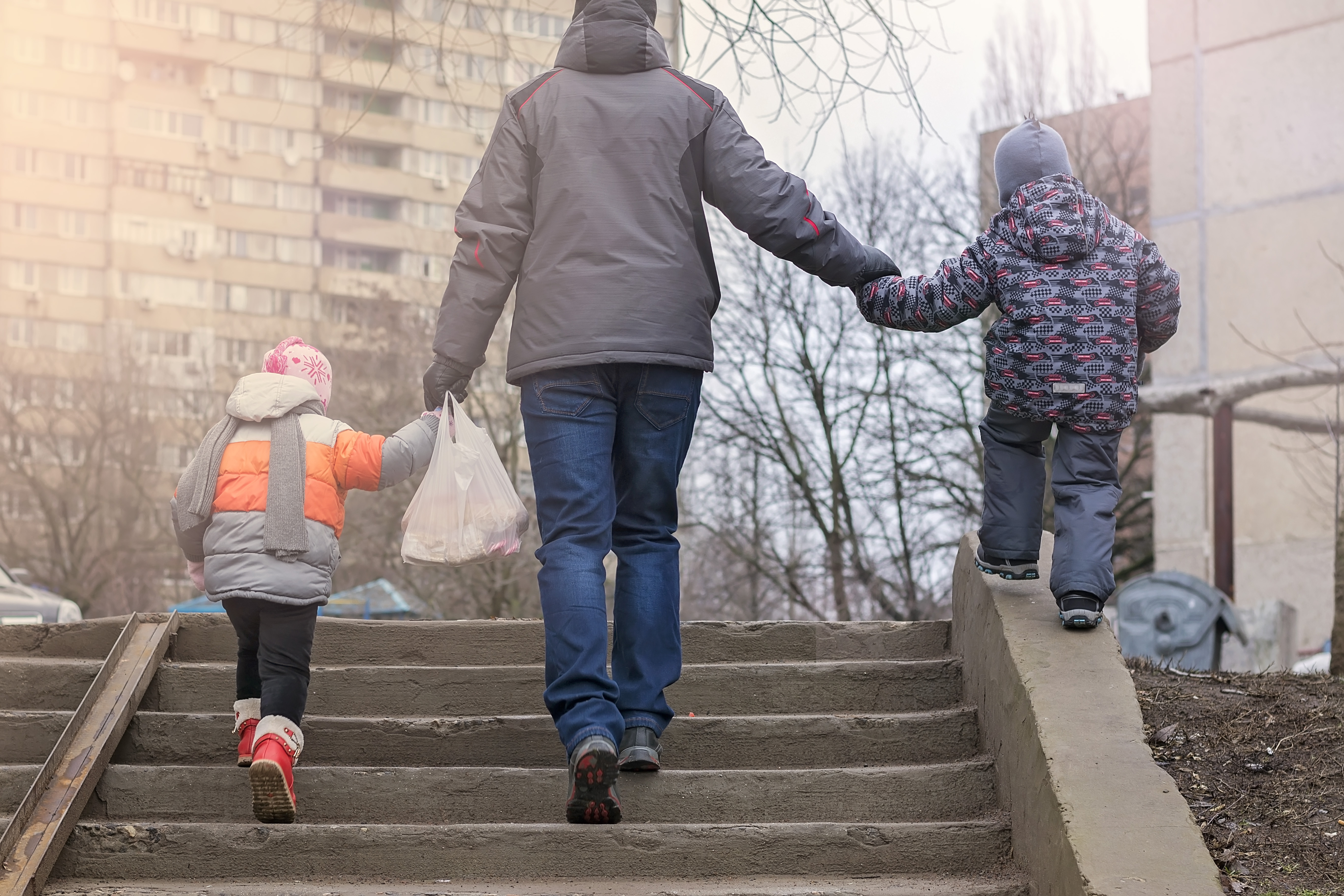 dad-walking-with-young-children.jpeg