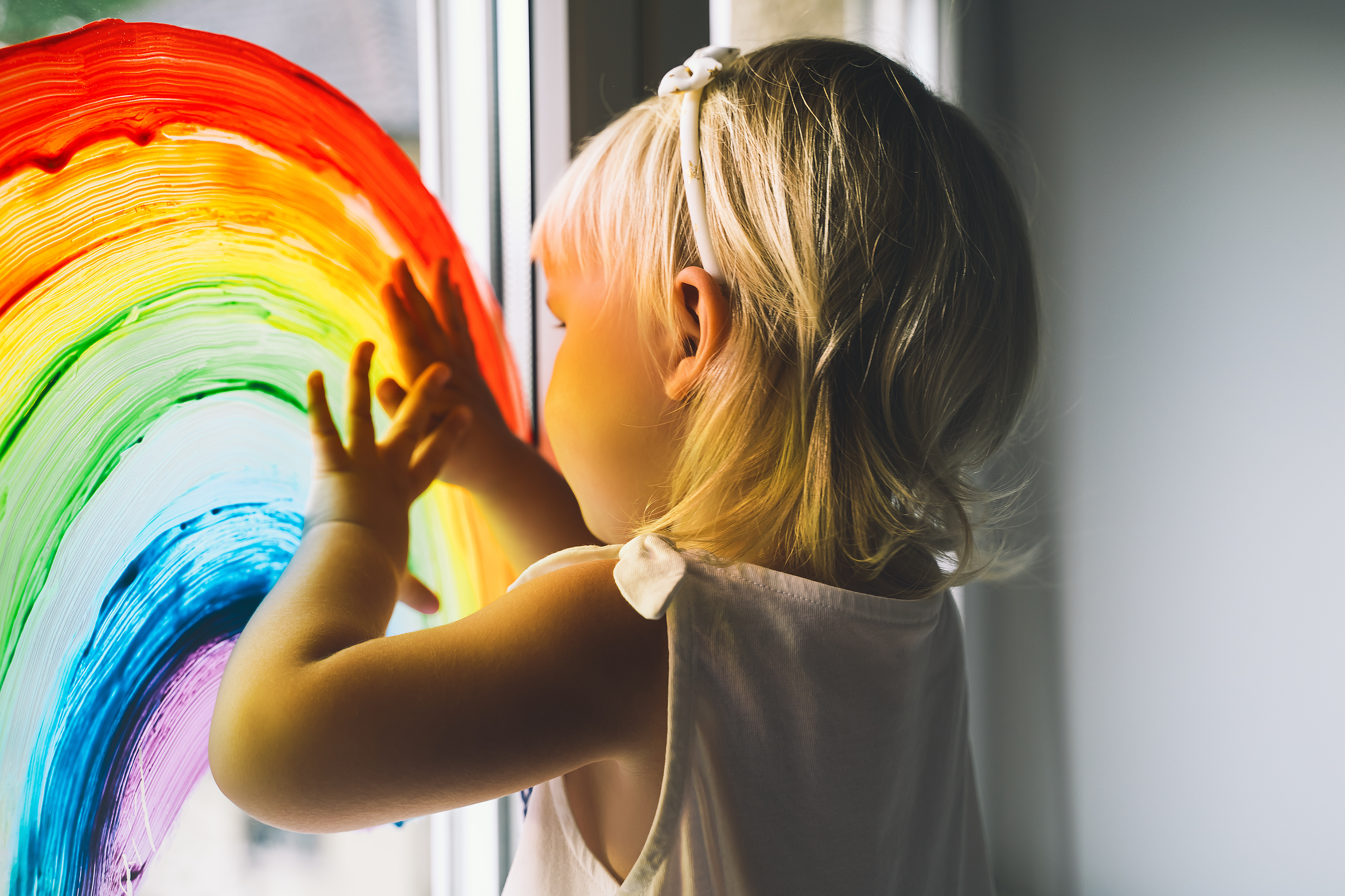 adobestock_344781220_girl-rainbow-window.jpeg