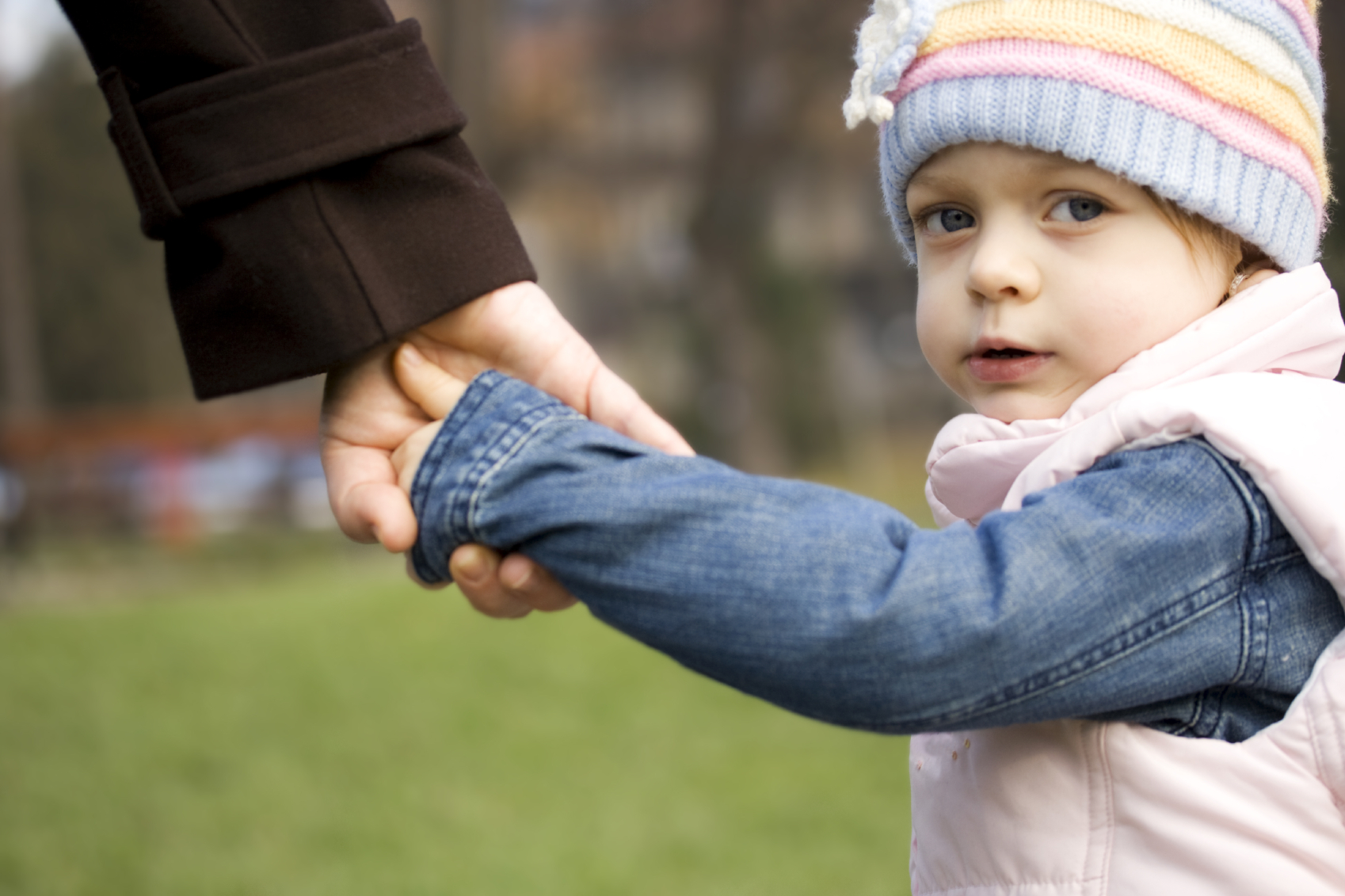 girl-holding-mums-hand.jpg