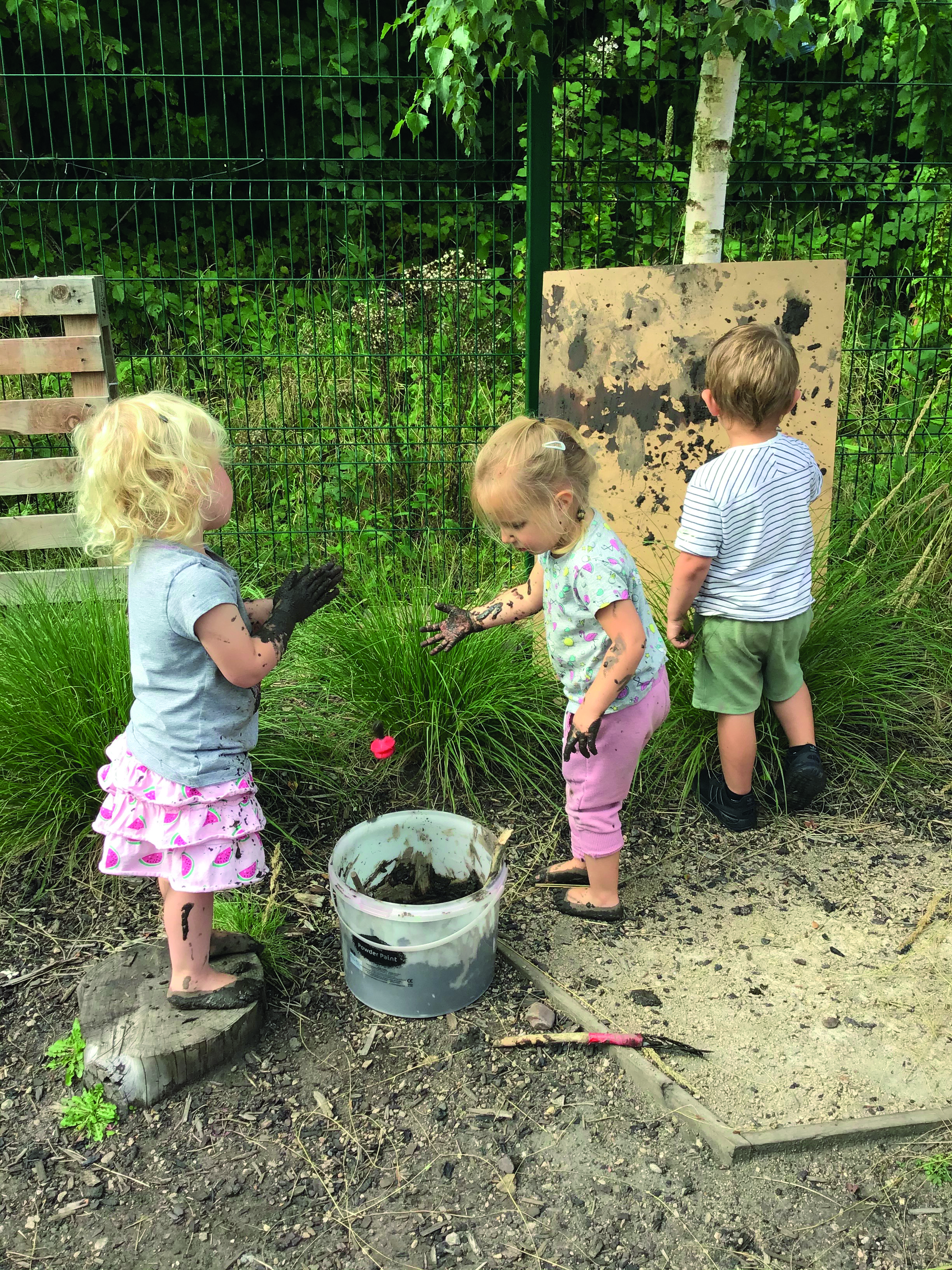 l-to-r-skye-florence-and-xander-playing-and-painting-with-mud.jpg