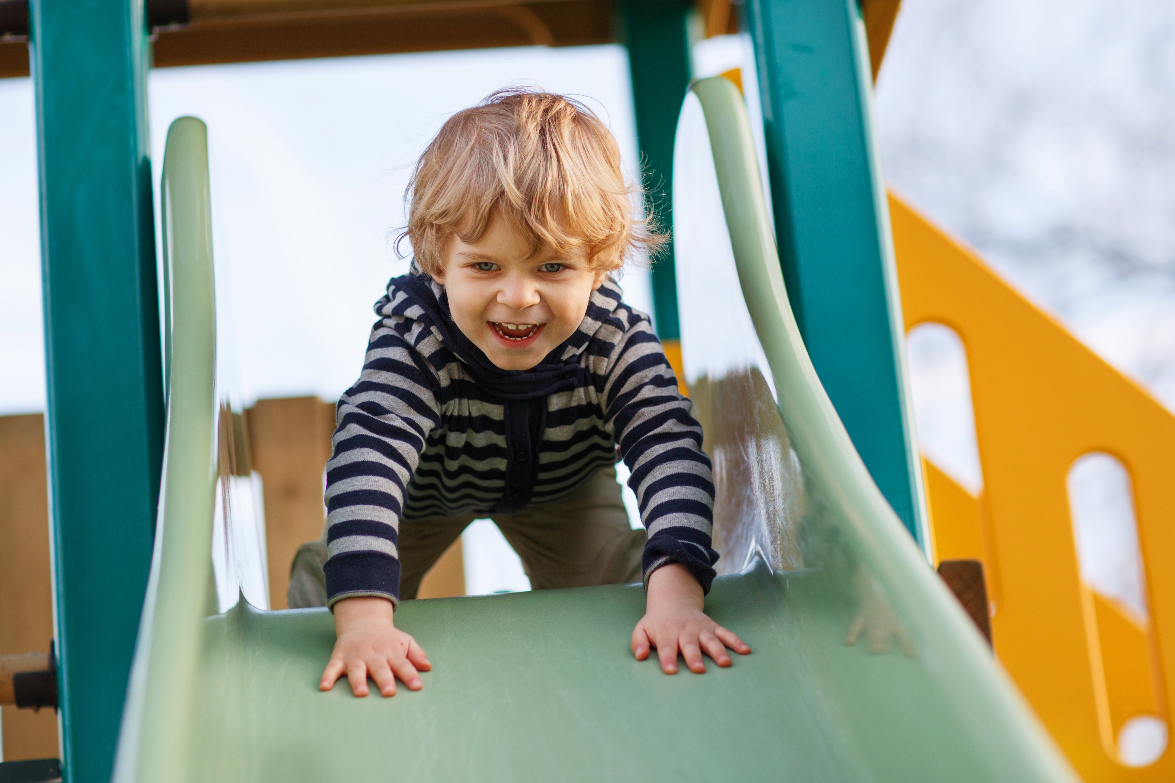 boy-going-down-a-slide.jpeg