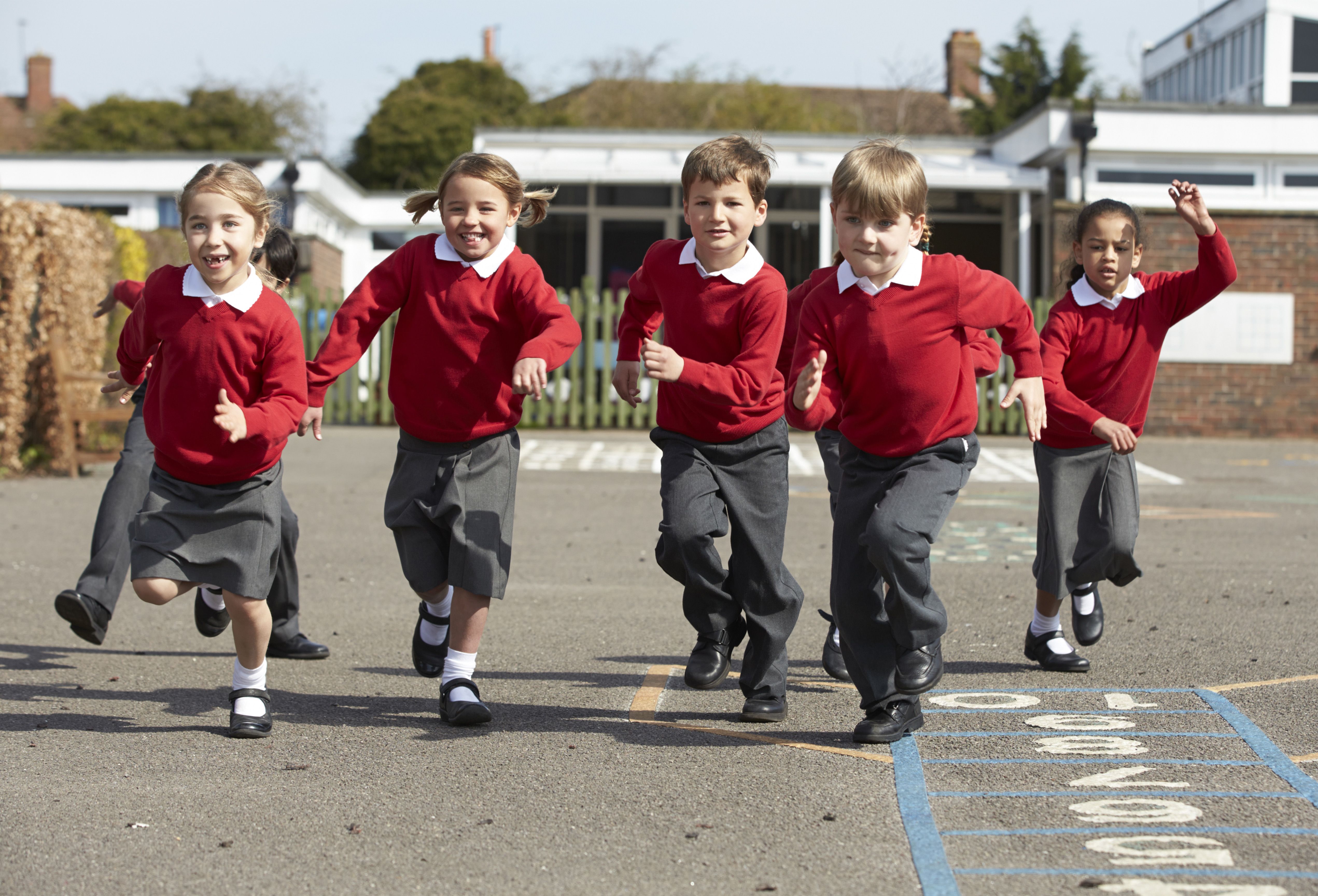 elementary-school-pupils-running-in-playground-1.jpg