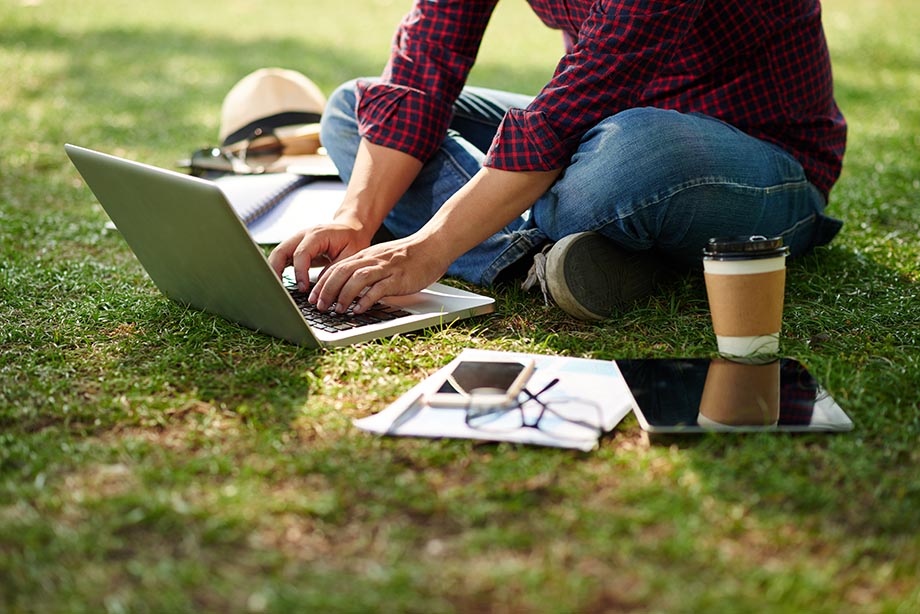 student-with-laptop-outside.jpg