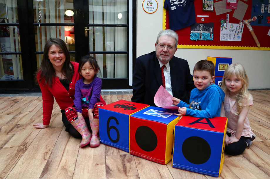 childrens-minister-aileen-campbell-and-education-secretary-michael-russell-with-children-at-busy-bees-nursery-gyle-edinburgh.jpg