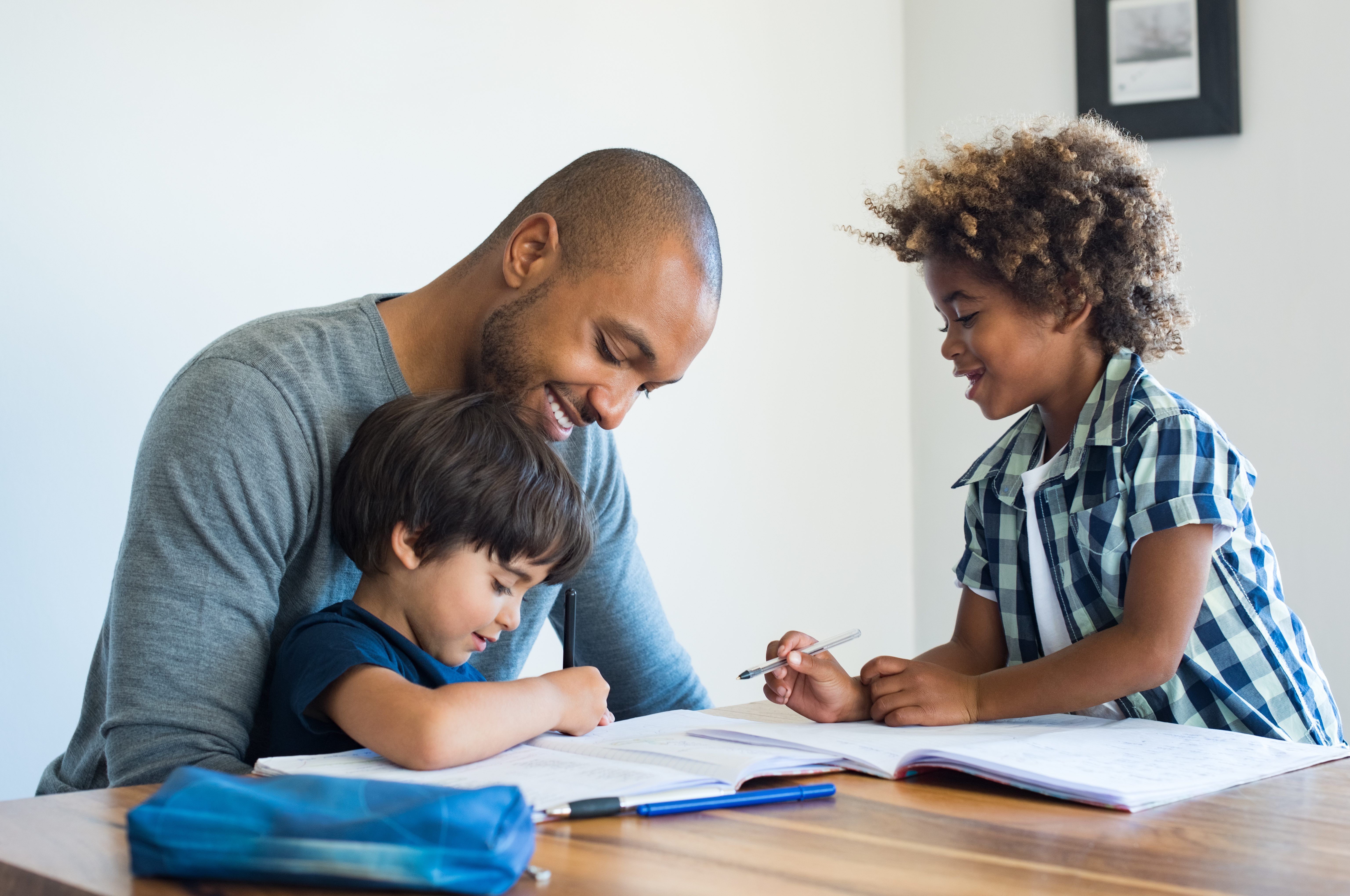 adobestock_164019874_dad-helping-sons-with-homework.jpeg