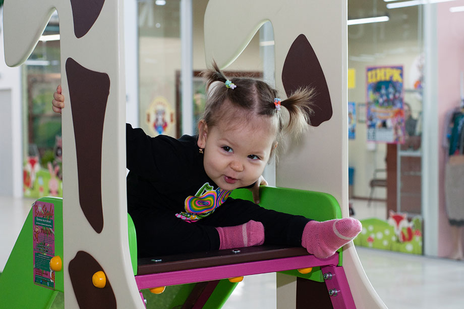 girl-playing-on-a-slide.jpg